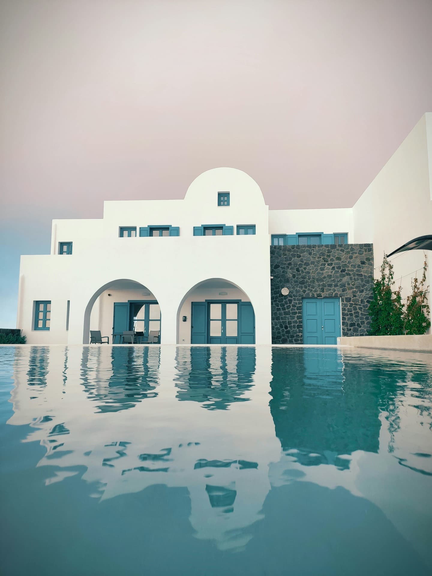 Whitewashed villa with arches and pool