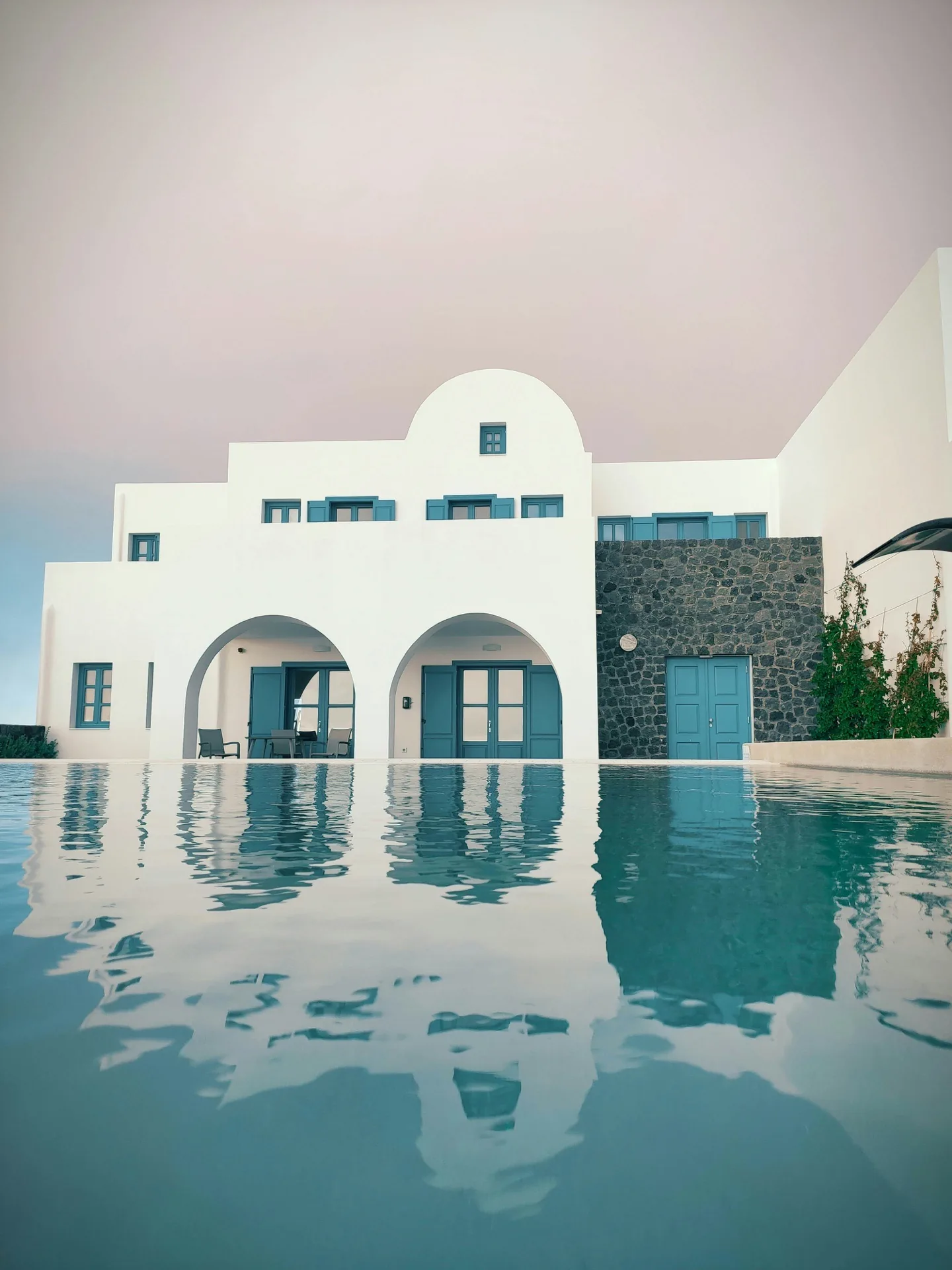 Whitewashed villa with arches and pool