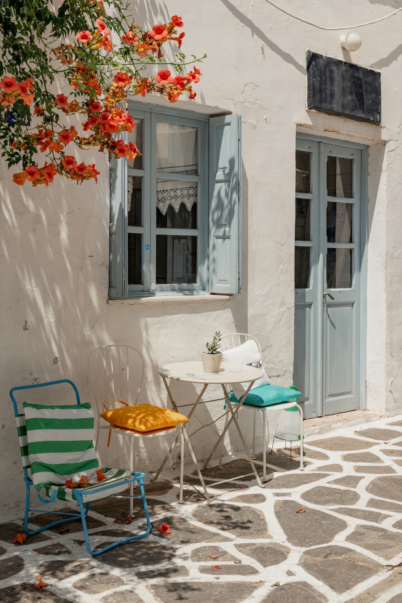 Greek terrace, blue shutters, bougainvillea