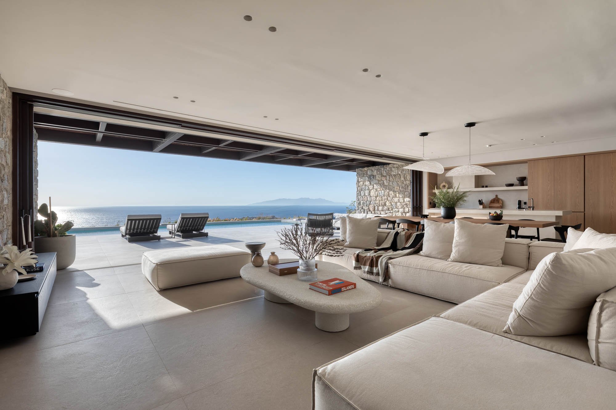 Living room opening on the pool and sea