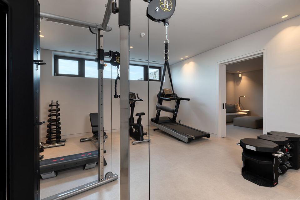 Private indoor gym with cable machine, treadmill and weights