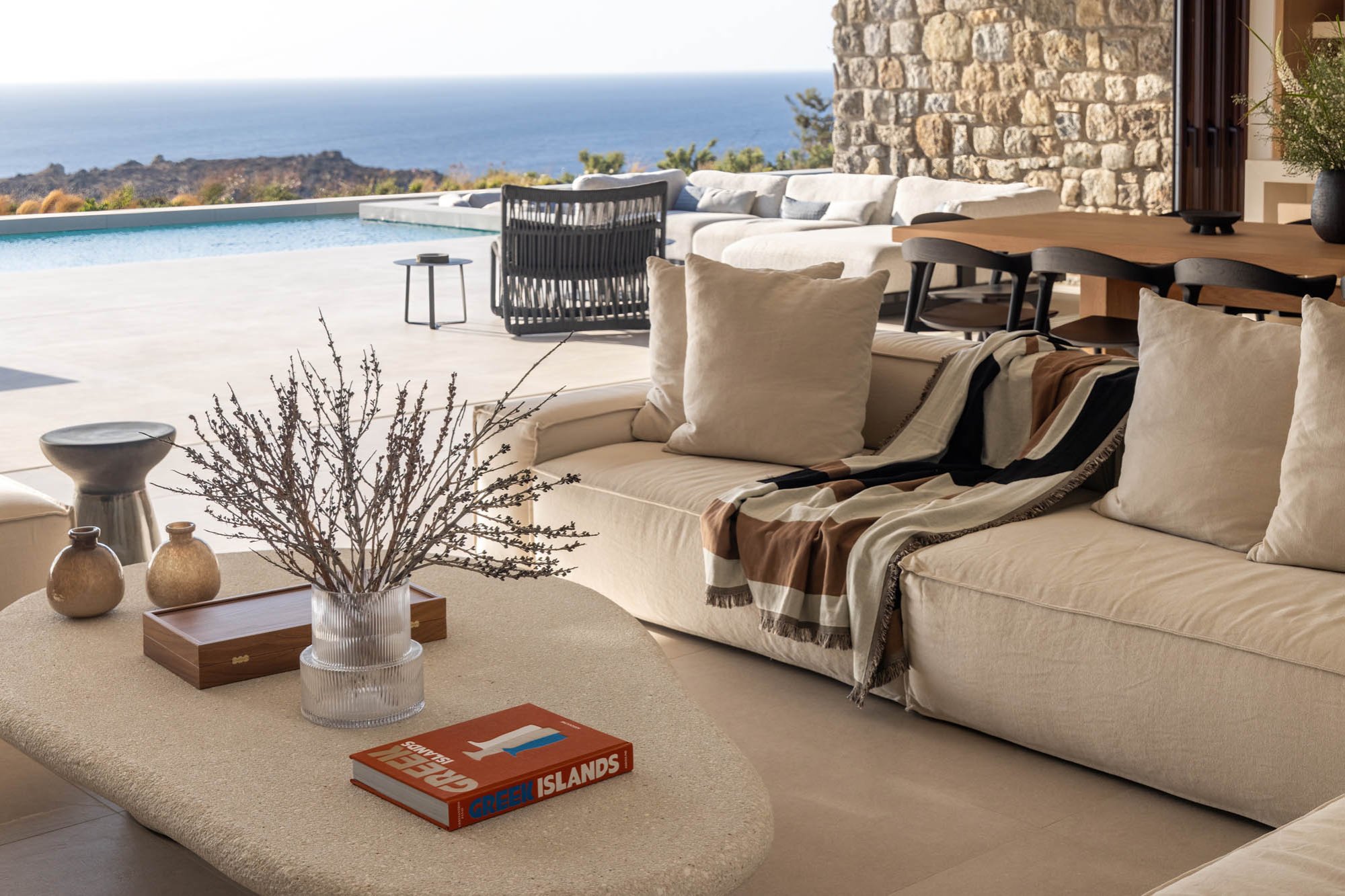 Evening lounge, warm tones by the stone wall