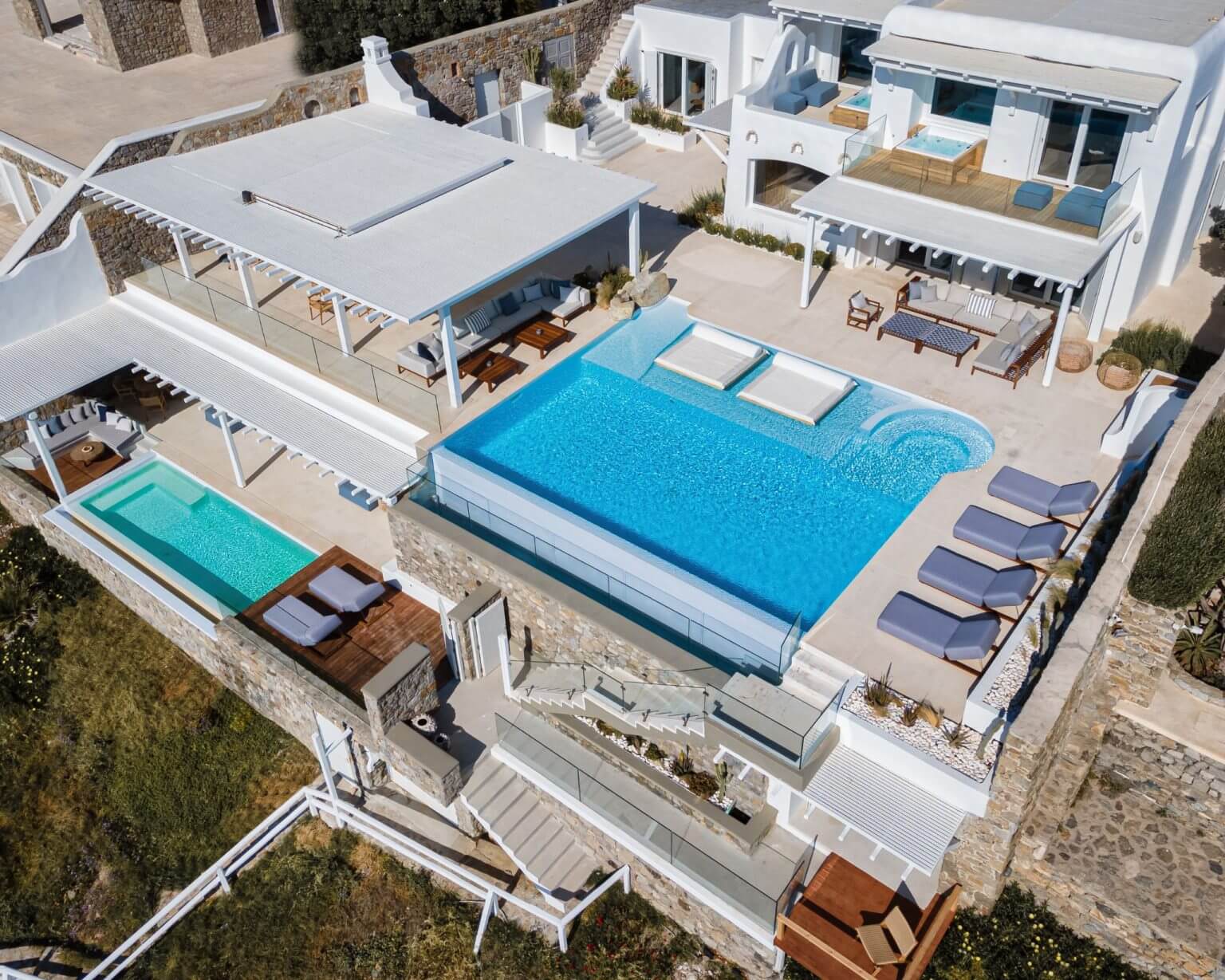 Aerial view of Villa Esmeralda showing both pools and the lower wing