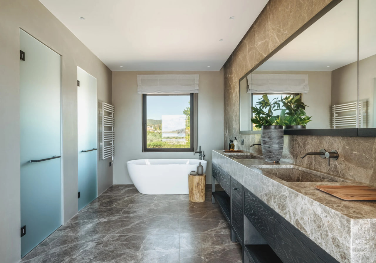 Marble bathroom with freestanding tub and double vanity