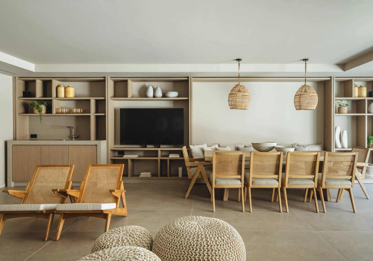 Lower-level living and dining, rattan chairs and woven pendants