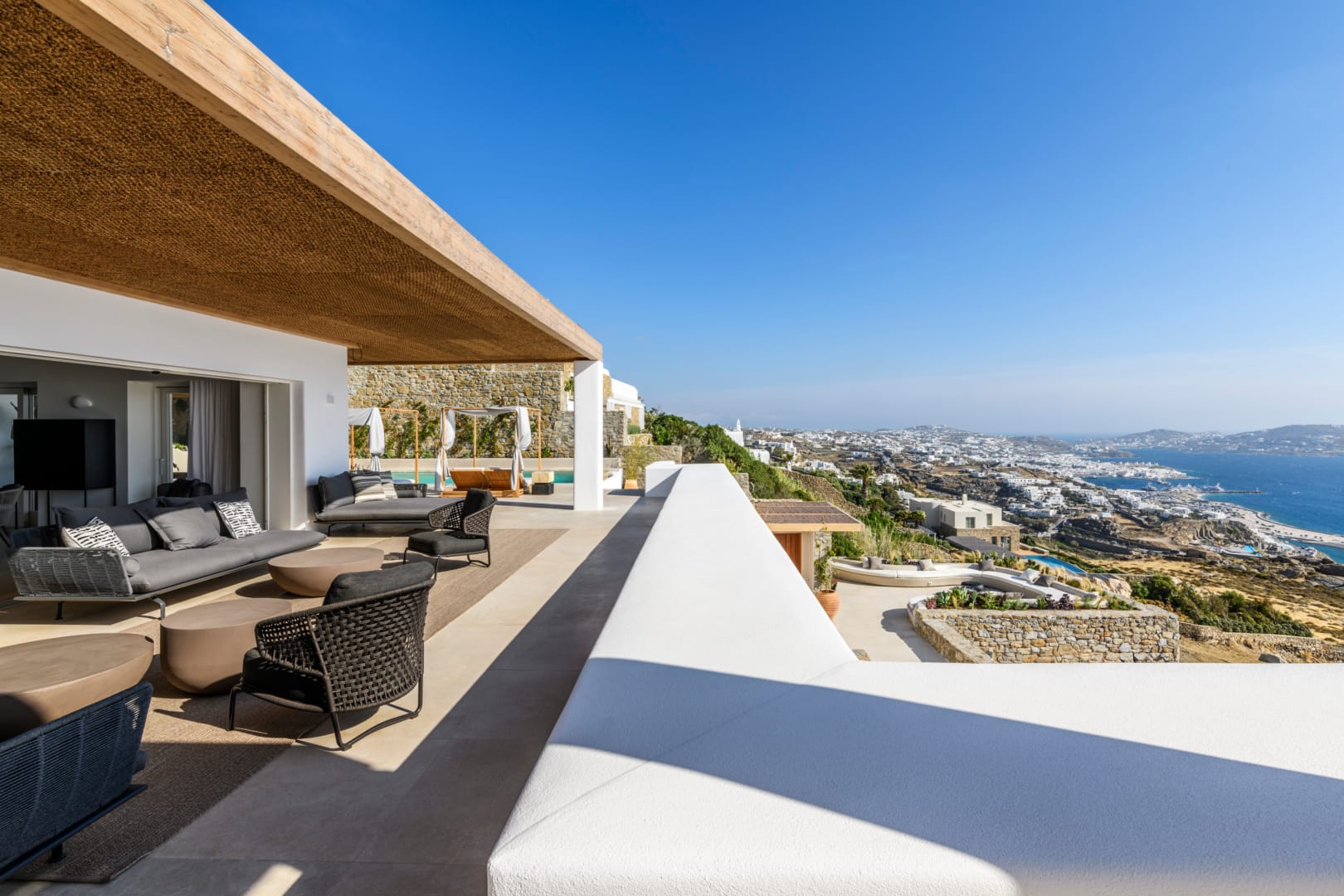 Daytime terrace and lounge with Mykonos chora panorama