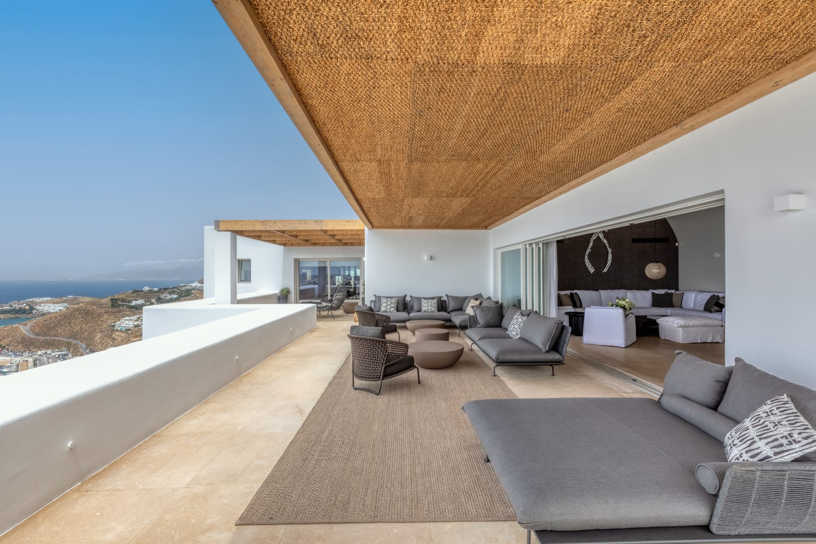 Covered terrace lounge with panoramic sea view