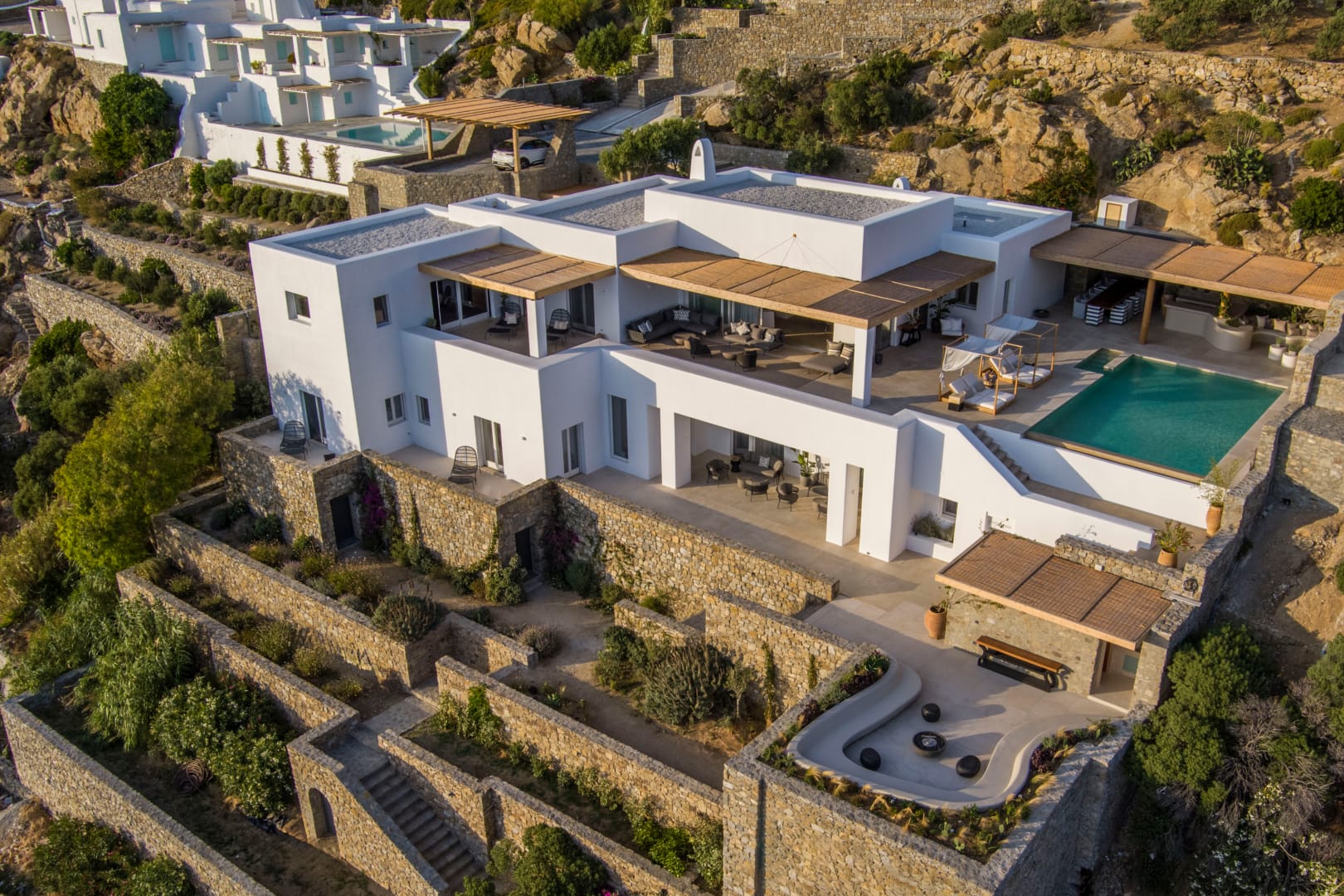 Aerial of the villa cascading down the Tourlos hillside