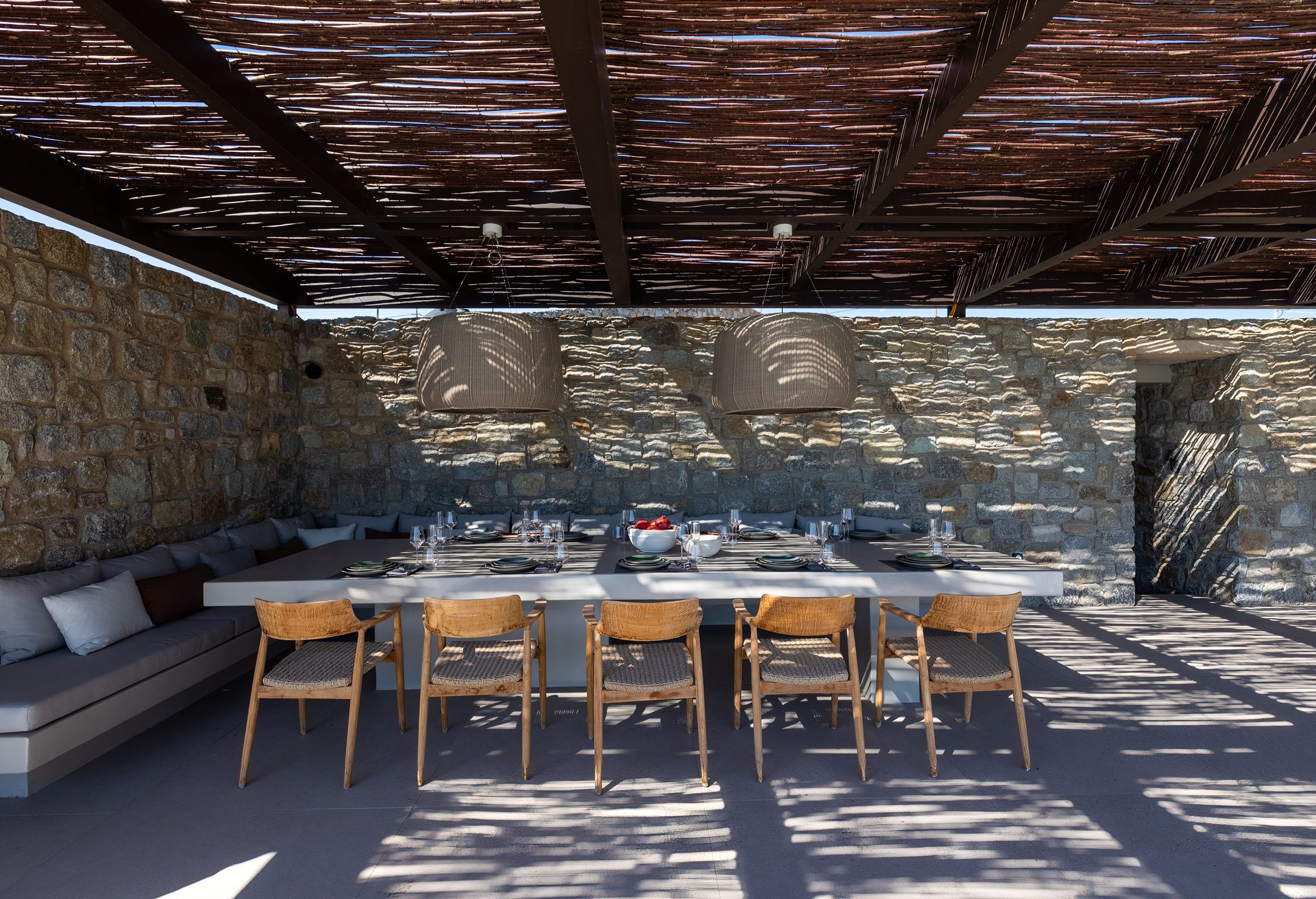 Outdoor pergola dining under bamboo, sea view lounges
